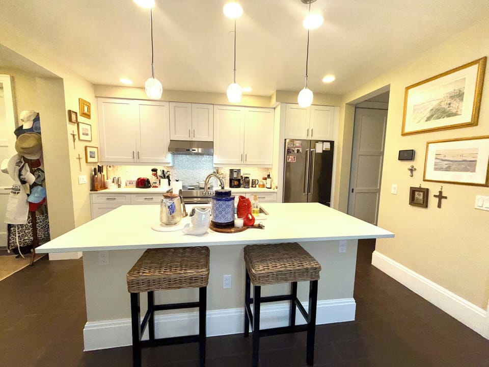 Kitchen with KitchenAid refrigerator, dishwasher and range