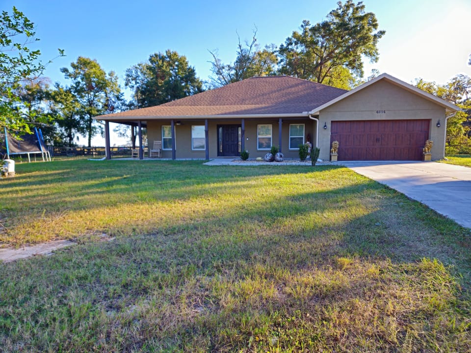 Front view with wraparound porch