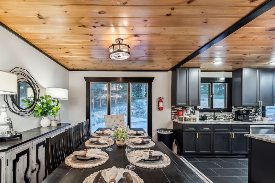 Modern kitchen with stainless steel appliances and warm wood finishes.