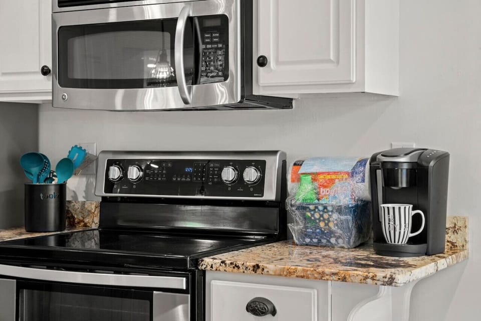 An updated kitchen, fully stocked with all the essentials you'll need for a relaxing stay, making cooking and dining a breeze.