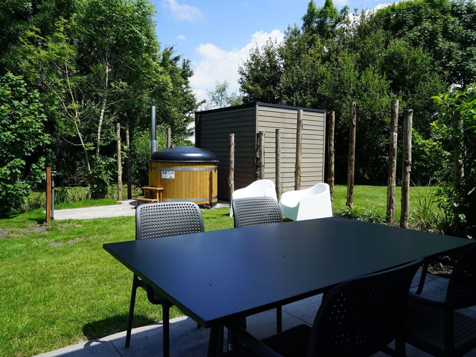 Table, Property, Plant, Building, Furniture, Tree, Sky, Shade, Cloud, Chair
