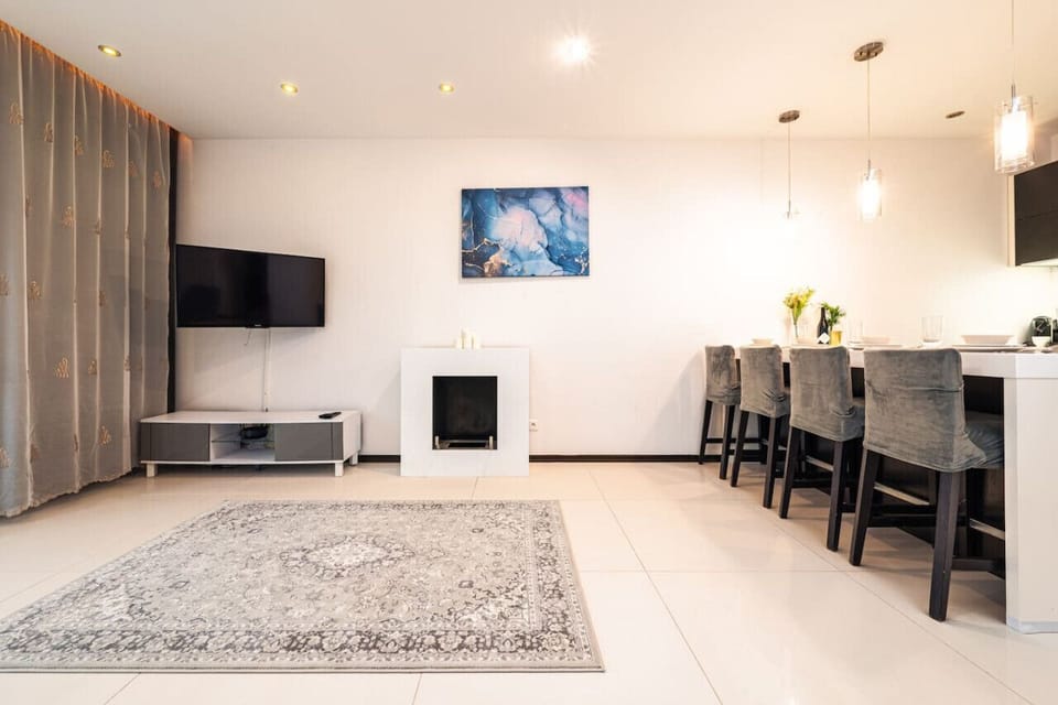 Comfortable Living Room with Sofa Bed and Smart TV | Book Now with RENTUJEMY