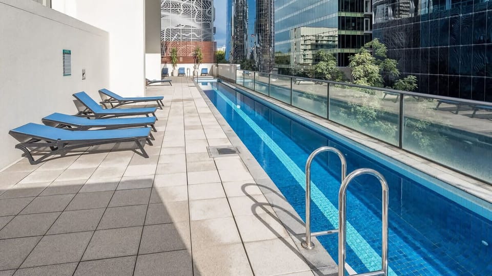 Take your morning laps with a view—this sleek, outdoor lap pool offers a refreshing escape right in the heart of the city, surrounded by contemporary urban architecture.