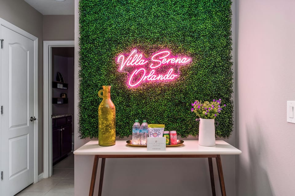 A minimalist table that contrasts beautifully against the vibrant neon lighting.