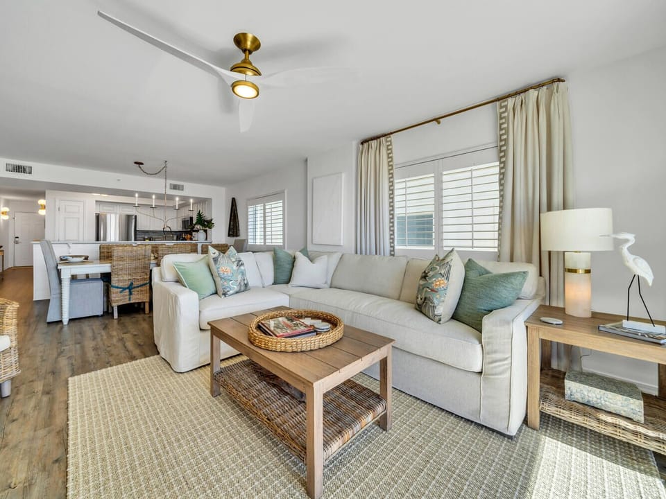 Sink into plush seating while the ceiling fan keeps you cool in your bright, open living space.