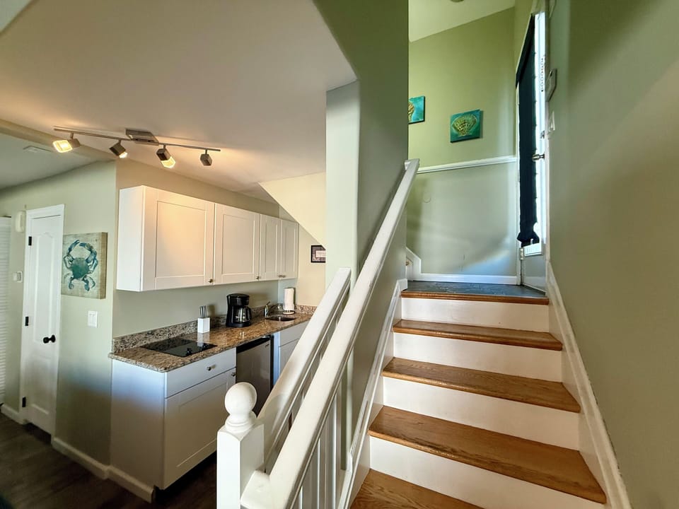 First floor Kitchenette with stairway to second level