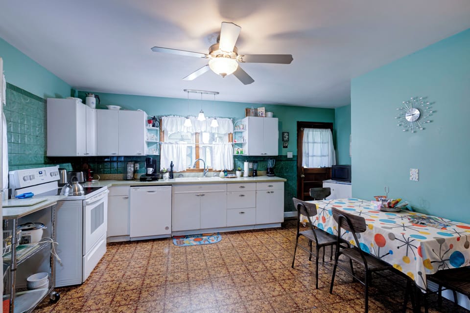 Bright retro-style kitchen with dining space and plenty of room to gather