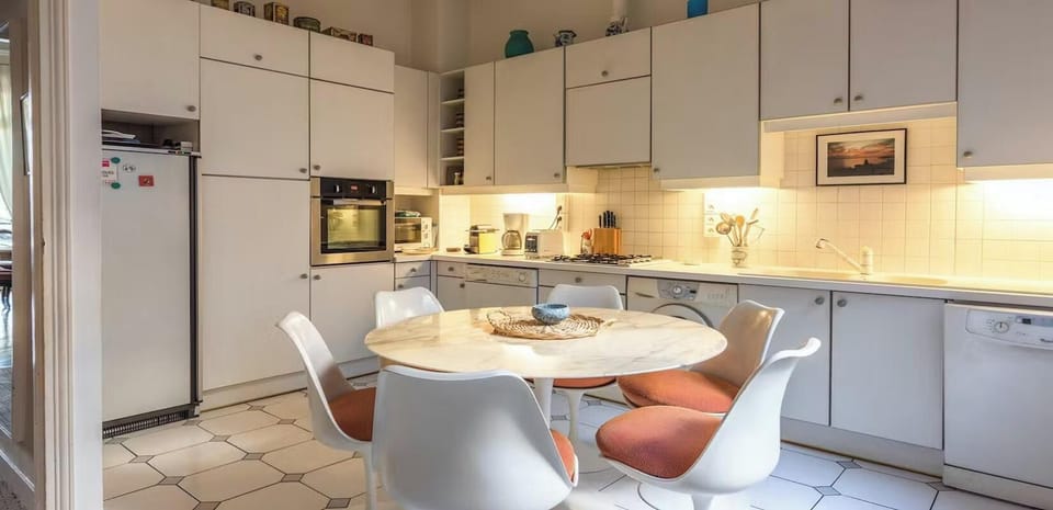 The 16 square meters separated eat in kitchen has a window facing courtyard 