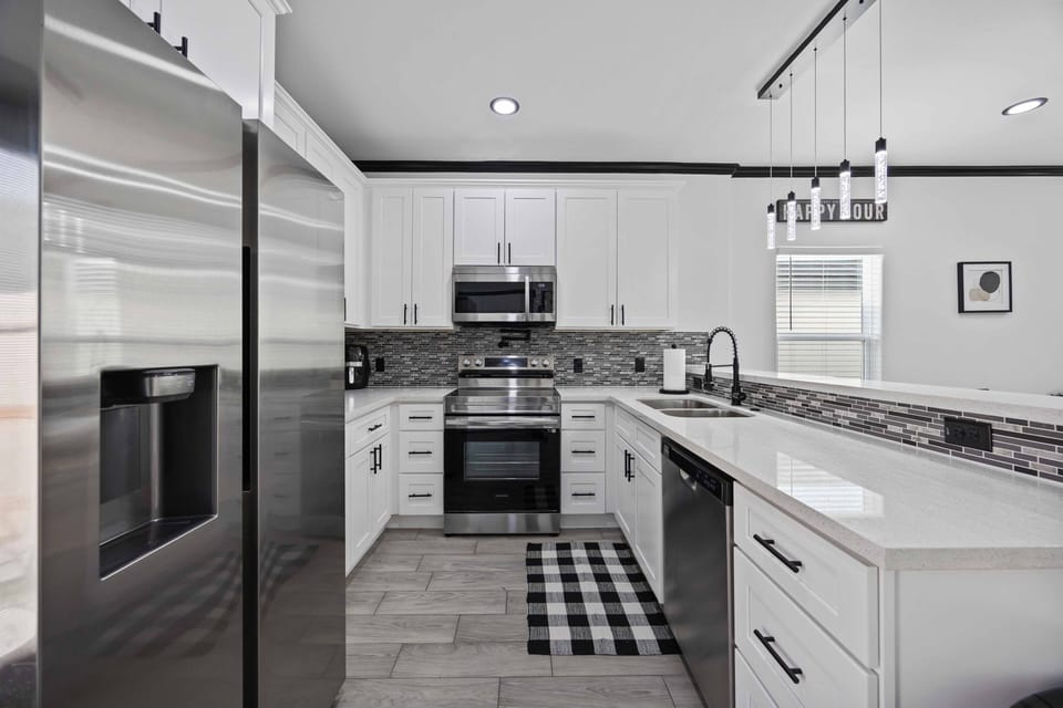 kitchen features stainless steel appliances and quiet close cabinetry