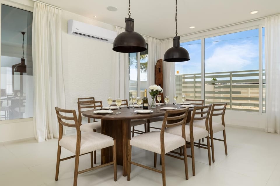 This large dining table, with seating for eight, is perfect for entertaining guests or hosting family dinners.