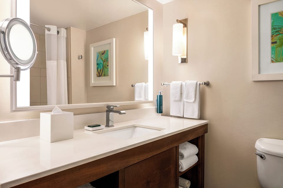 Recharge in a spacious king room with warm evening light.