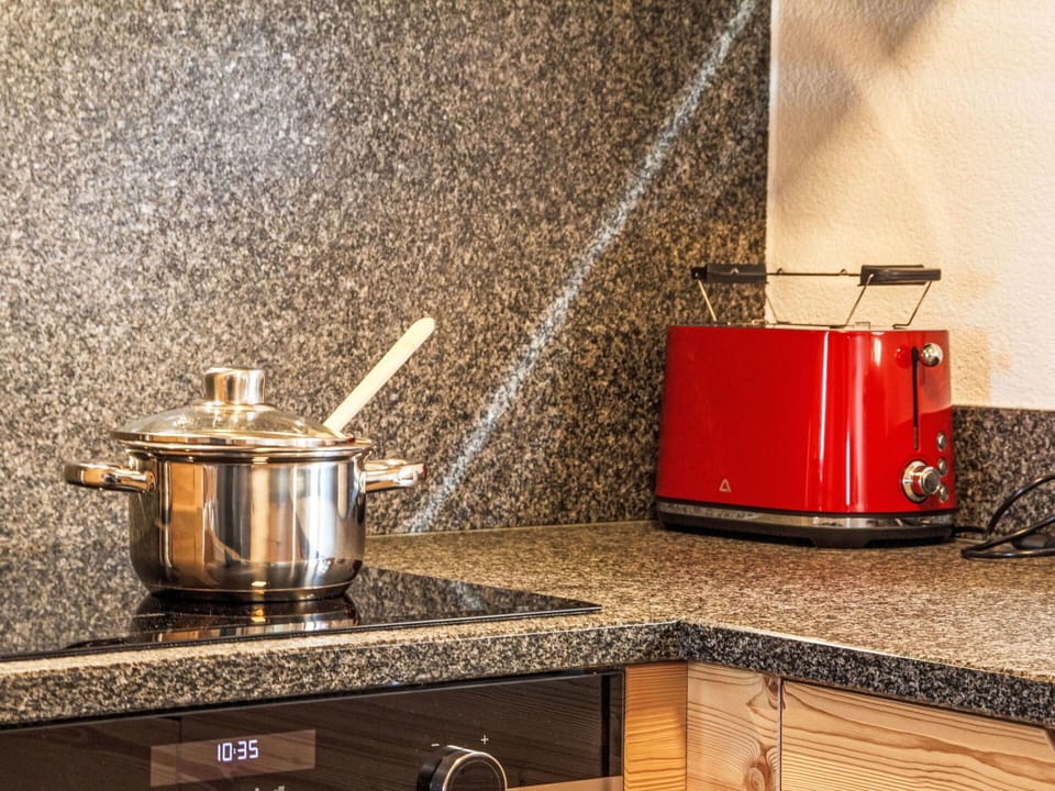 Property, Countertop, Kitchen, Wood, Lighting, Interior Design, Kitchen Appliance, Kitchen Stove, Cabinetry, Flooring