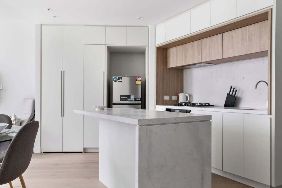 The kitchen with an island bench.