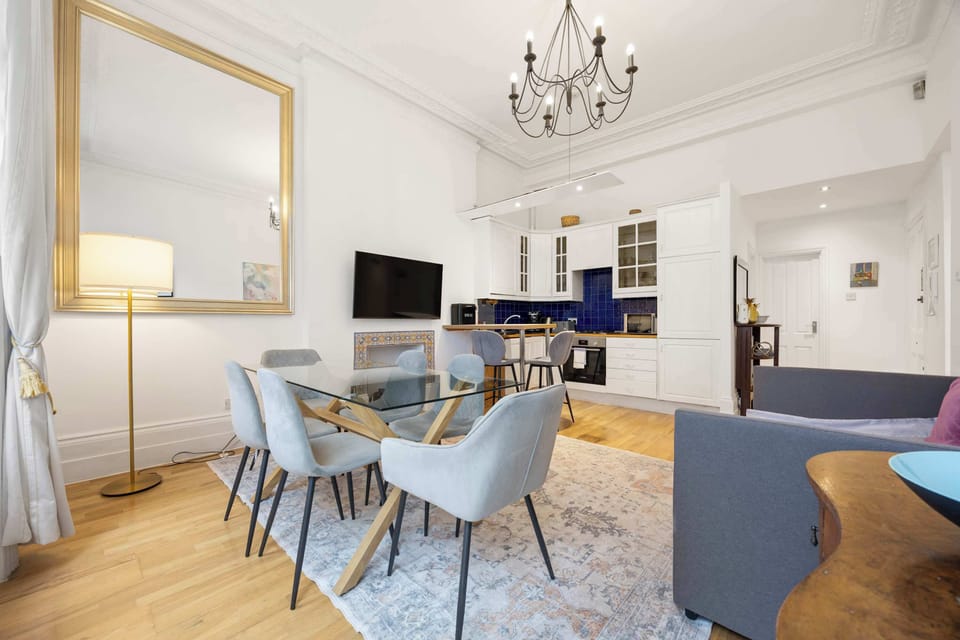 Open space living/dining/kitchen area - with lots of light and access to the balcony