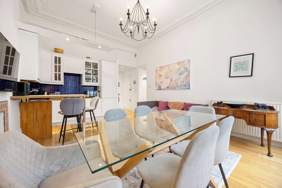 Open space living/dining/kitchen area - with lots of light and access to the balcony