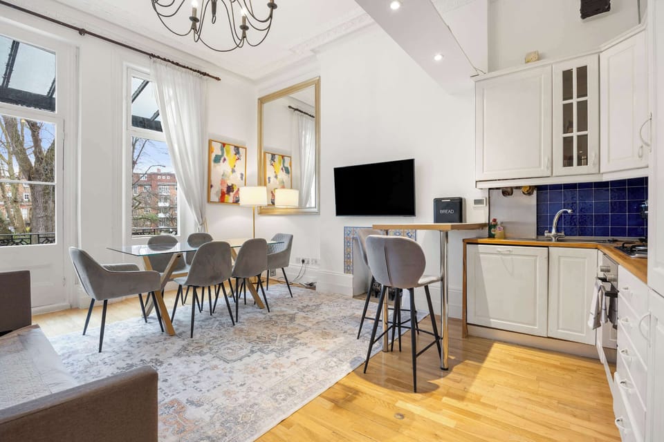 Open space living/dining/kitchen area - with lots of light and access to the balcony