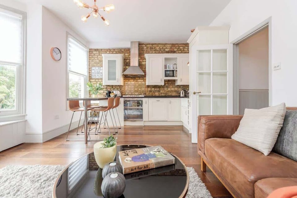 Kitchen is fully equipped and with modern appliances. It has a wooden breakfast bar where you can enjoy your meals and socialise