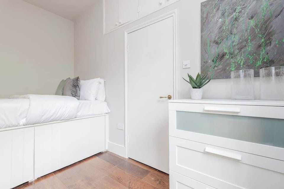 Bedroom 2 - it has a double bed (it is high, so you need a stool to get on it) and storage space for your belongings