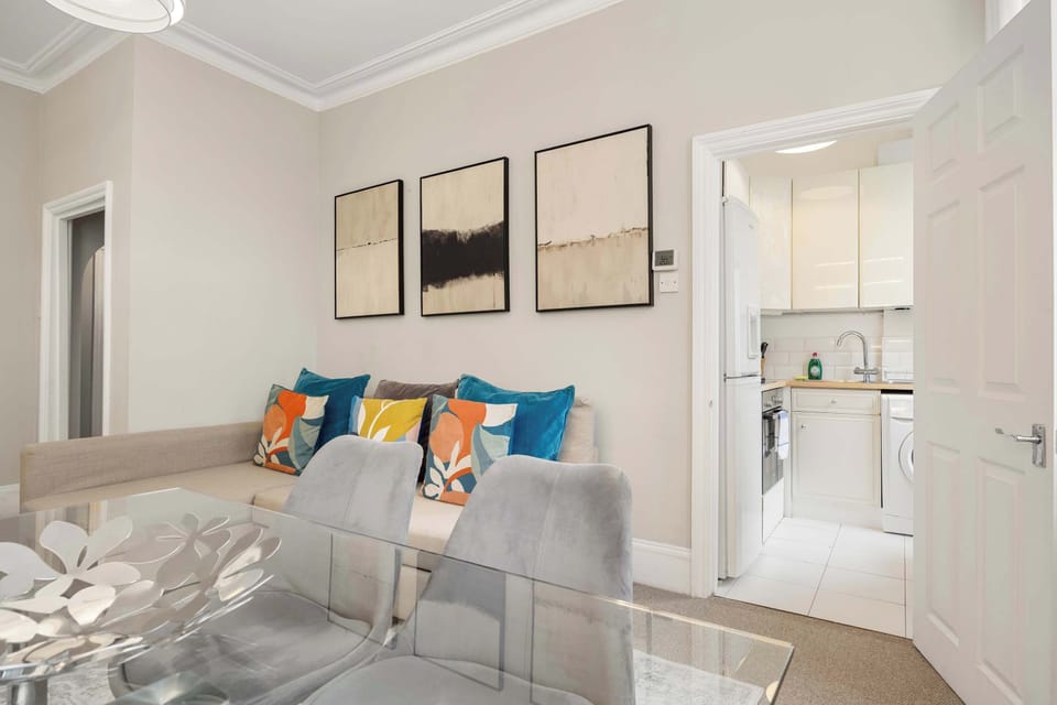 Living & Dining Area - to relax and socialise. It has a TV. Sofa can be set up as a sofa bed