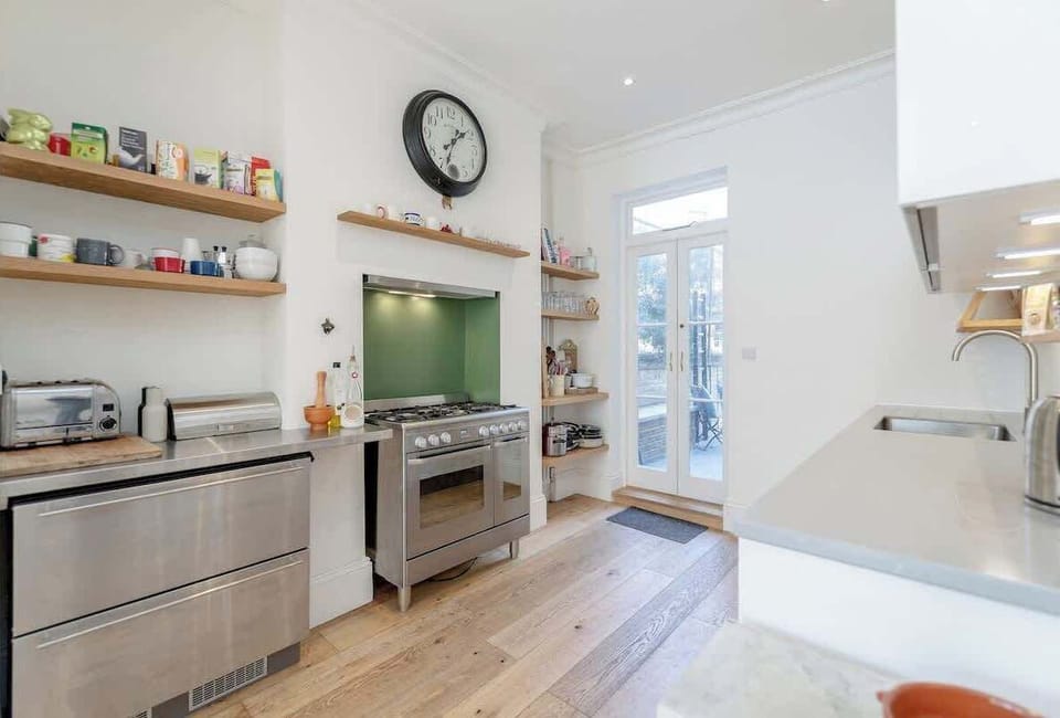 Ground floor - as soon as you enter you will find an open space with a sofa, the dining area, and a fully equipped kitchen. There is a small terrace at the back