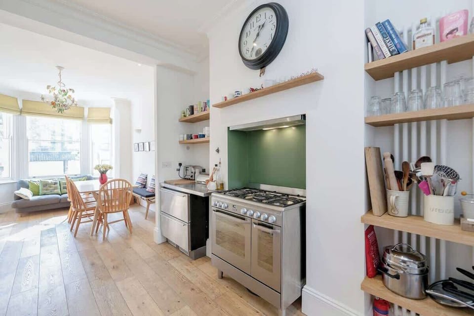 Ground floor - as soon as you enter you will find an open space with a sofa, the dining area, and a fully equipped kitchen. There is a small terrace at the back