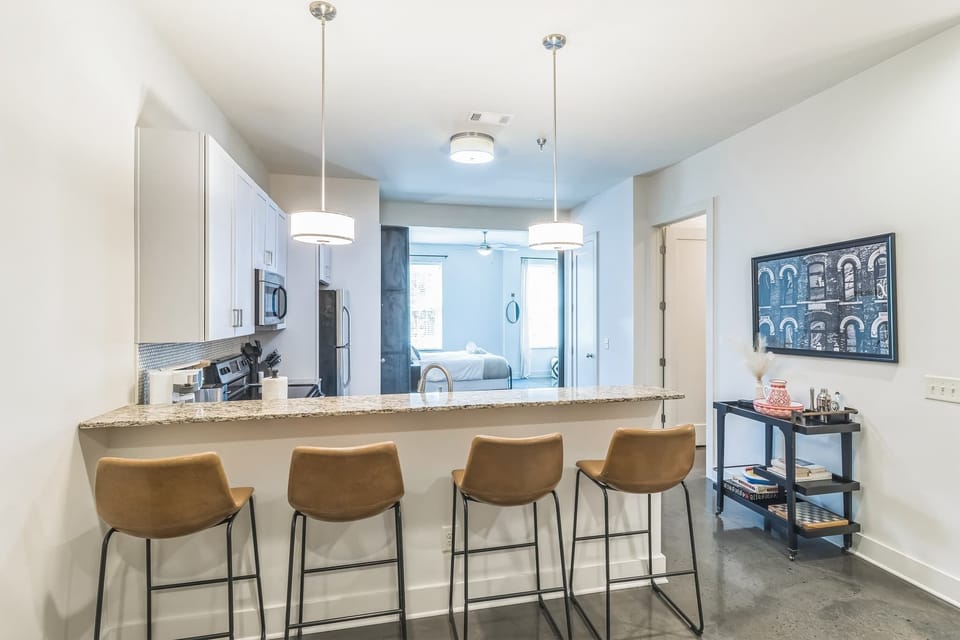 Sip morning coffee or enjoy gourmet bites at the kitchen counter, seating 4