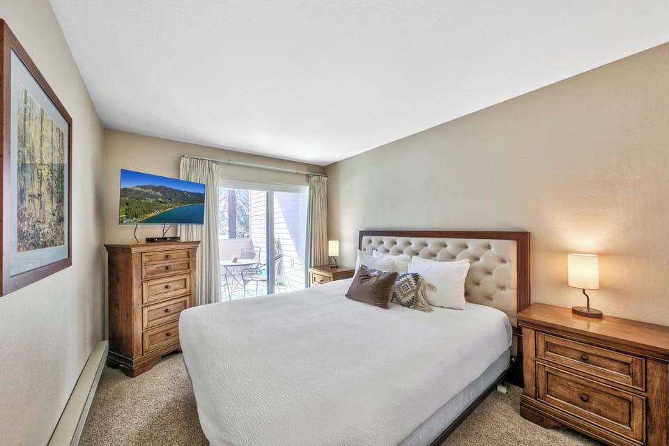 Your peaceful bedroom features a plush king bed and opens to a private balcony where morning coffee awaits.