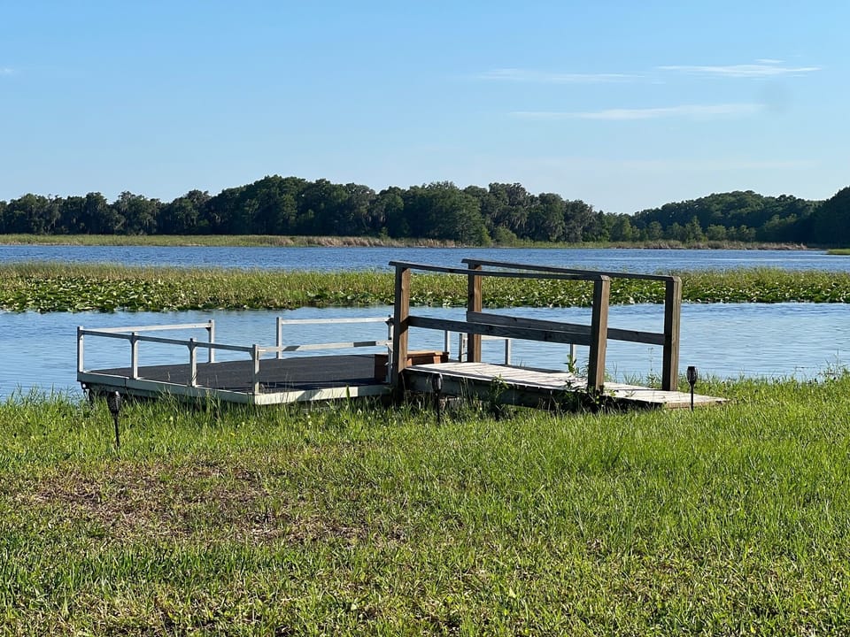Launch one of the (3) kayaks from the floating dock or pull up a chair and relax
