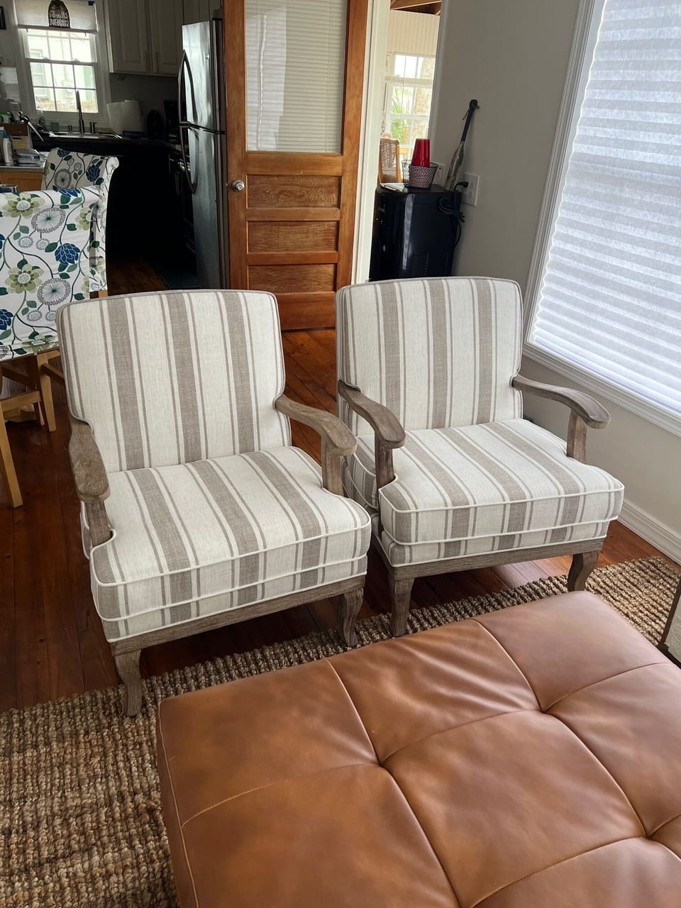Comfy chairs with a big ottoman to unload your feet.