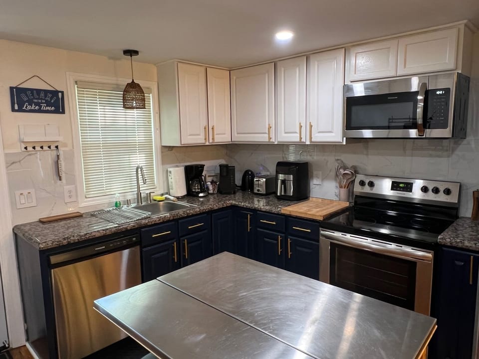Full kitchen that includes cookware, utensils, dishes and spices to cook.