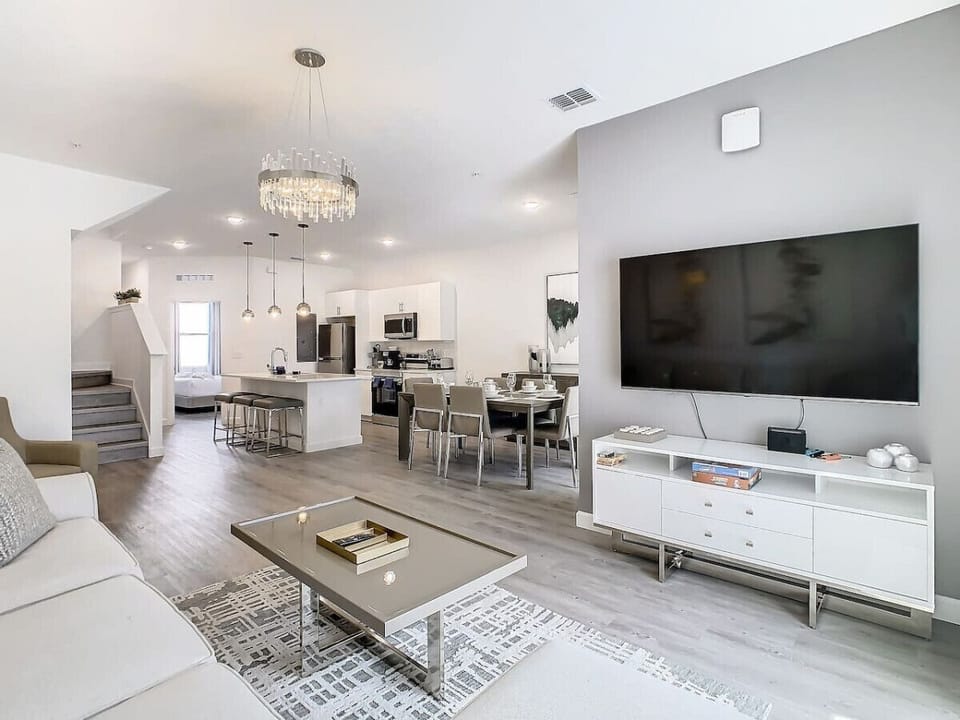 Unwind in the cozy living room, perfect for movie nights or relaxing after a day at the parks.