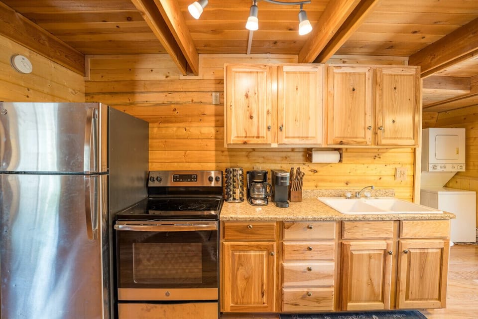 Cook, sip, and savor—your perfect cabin kitchen awaits!