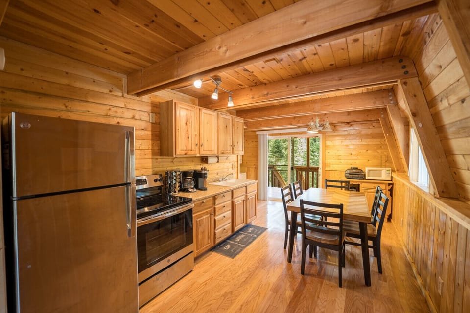 Gather, cook, and create memories in this cozy cabin kitchen.