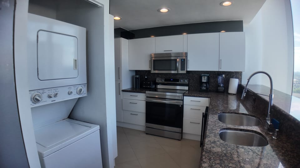 Kitchen with scenic ocean/city views