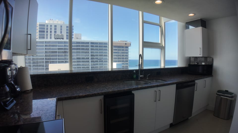 Kitchen with scenic ocean/city views