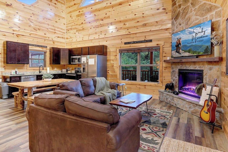 Cozy cabin living area with a stone fireplace and rustic wood accents.