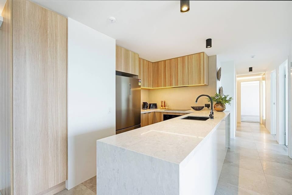 A spacious and contemporary kitchen has all the essentials needed to cook meals at home