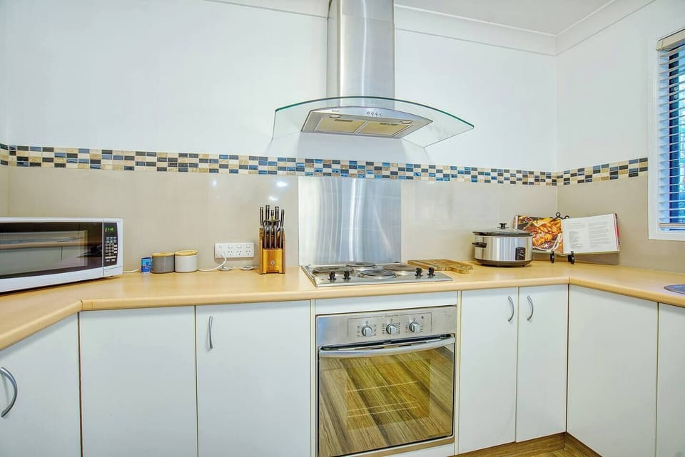 The kitchen has a fridge, oven and gas cooktop, dishwasher, microwave, essential cooking utensils and a Nespresso machine and a French press