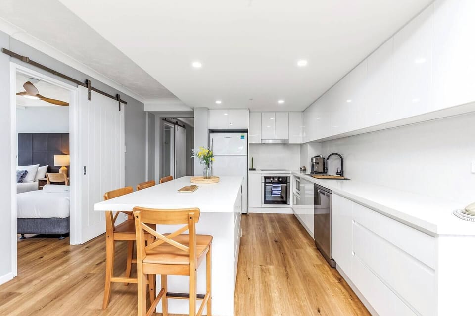  The modern, streamlined kitchen offers all the essentials needed to prepare meals at home. 