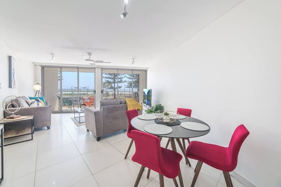 Open plan living area lets in loads of light and is complete with a dining table to comfortably fit four people