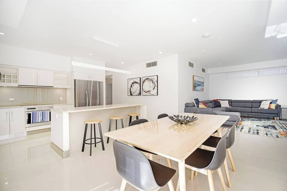 Open plan living offers comfort and space to entertain, flowing out to the private balcony.