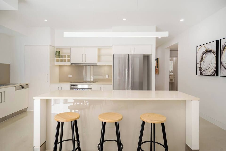  The kitchen is designed around a central island bench, with a breakfast bar to take things slow in the morning.
