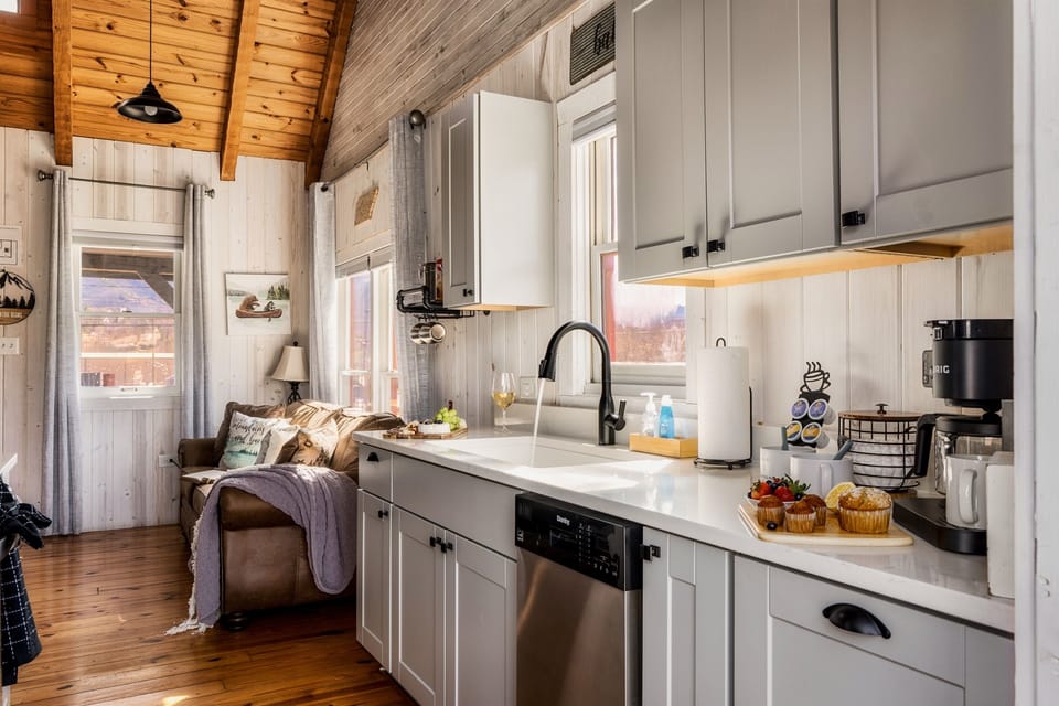 Updated modernized kitchen with exquisite granite counters. Ready for your next culinary meal. Enjoy a vibrant mountain view from the kitchen window!