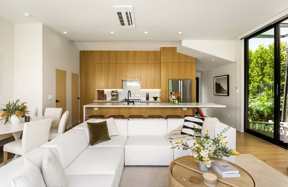 Step into a bright and airy living room bathed in natural light—perfect for relaxing or gathering with loved ones. Featuring a plush sofa, entertainment setup, and thoughtful design touches for your comfort and enjoyment.