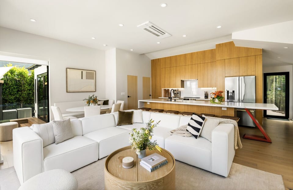 Step into a bright and airy living room bathed in natural light—perfect for relaxing or gathering with loved ones. Featuring a plush sofa, entertainment setup, and thoughtful design touches for your comfort and enjoyment.