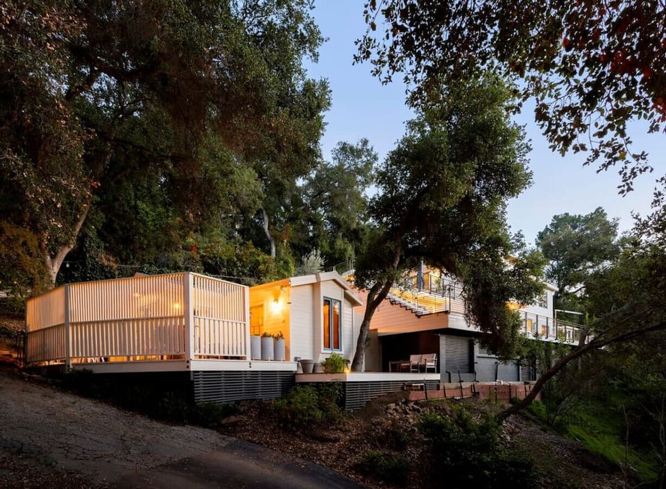 Enjoy a quiet stay in the lower guest house, nestled below the main house, offering privacy with a split-level design and wraparound fence.