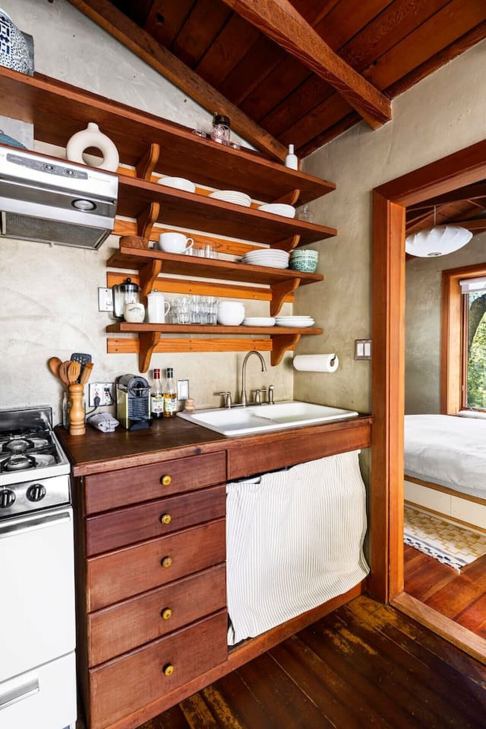 Stocked mini kitchen with a stove and fridge, providing everything you need for a convenient stay.