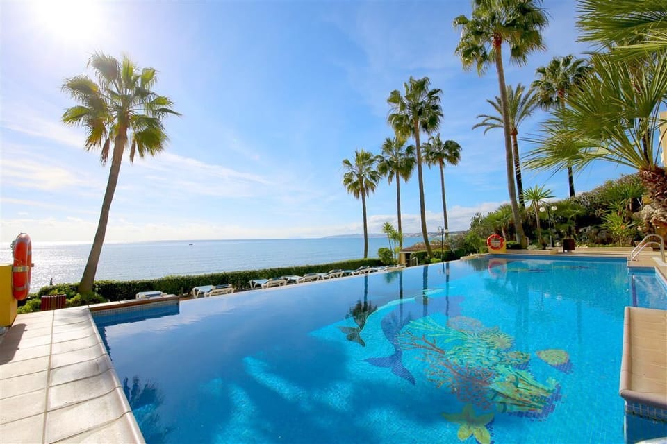 Inviting communal pool available for guests with sea views