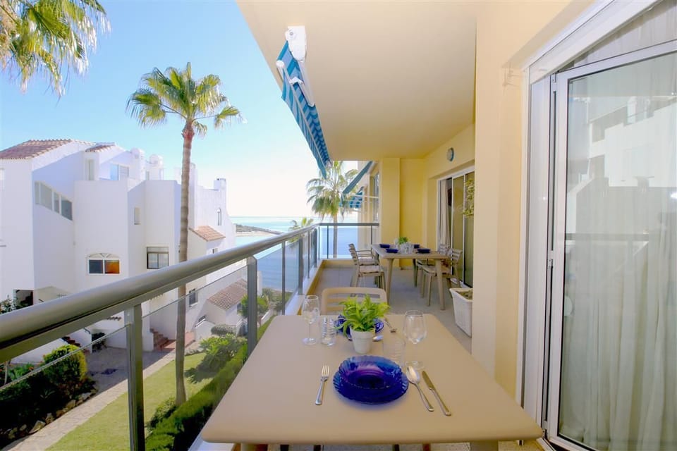 Large terrace with outdoor dining area for six guests and sea views