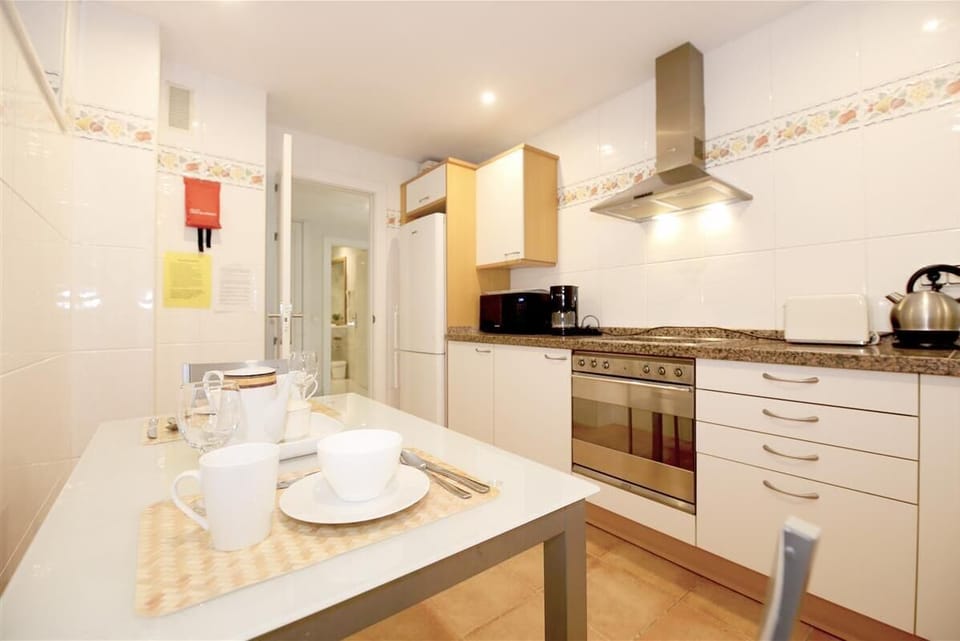 Another picture of the fully-fitted kitchen with dining table for two guests